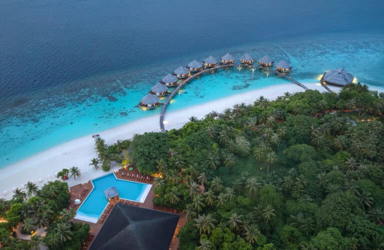 Overwater bungalows and tropical island at Adaaran Select Meedhupparu.