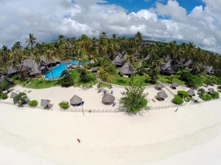 Aerial view of Ocean Paradise Resort & Spa with beach, pool, and lush greenery.