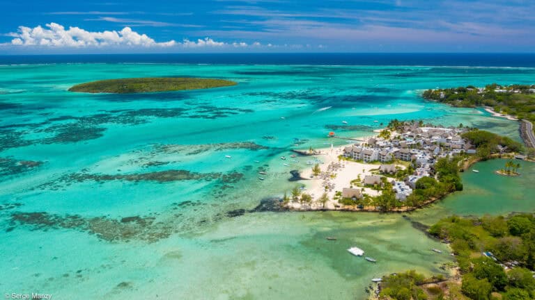 Aerial view of Preskil Island Resort with turquoise waters and white sandy beaches.