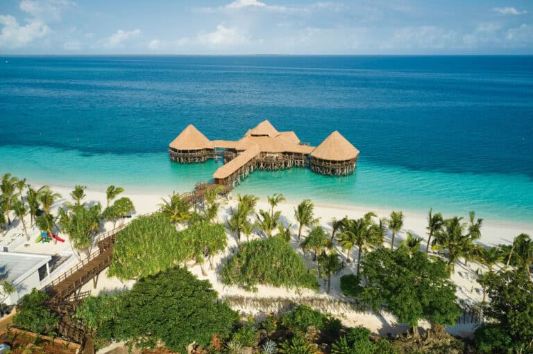 Overwater bungalows at Riu Jambo Zanzibar with turquoise ocean view.
