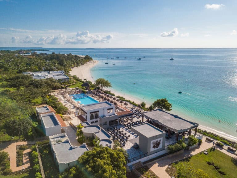 Luxury beachfront resort at Hotel Riu Palace Zanzibar with pool and ocean views.