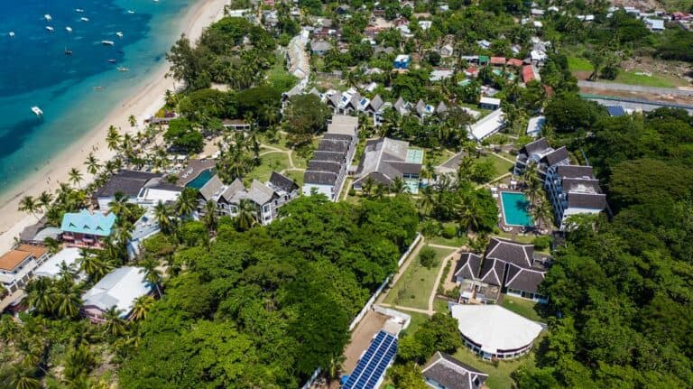 Aerial view of Royal Beach Nosy Be with beach, pool, and lush greenery.